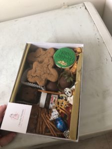 A box of various chocolate treats and other goodies