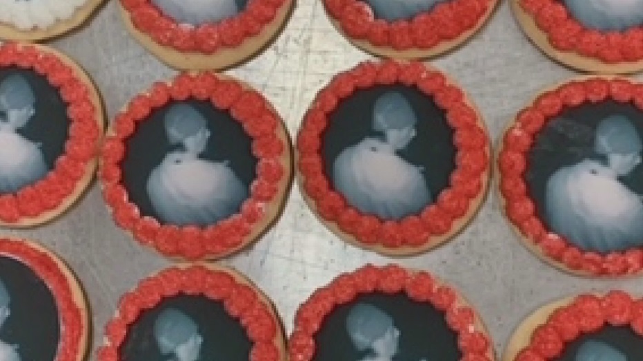 Photo of a cookie with the suspect's face decorating it.