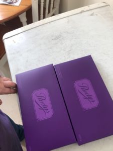 Two Purdy's Braille Chocolates boxes next to each other